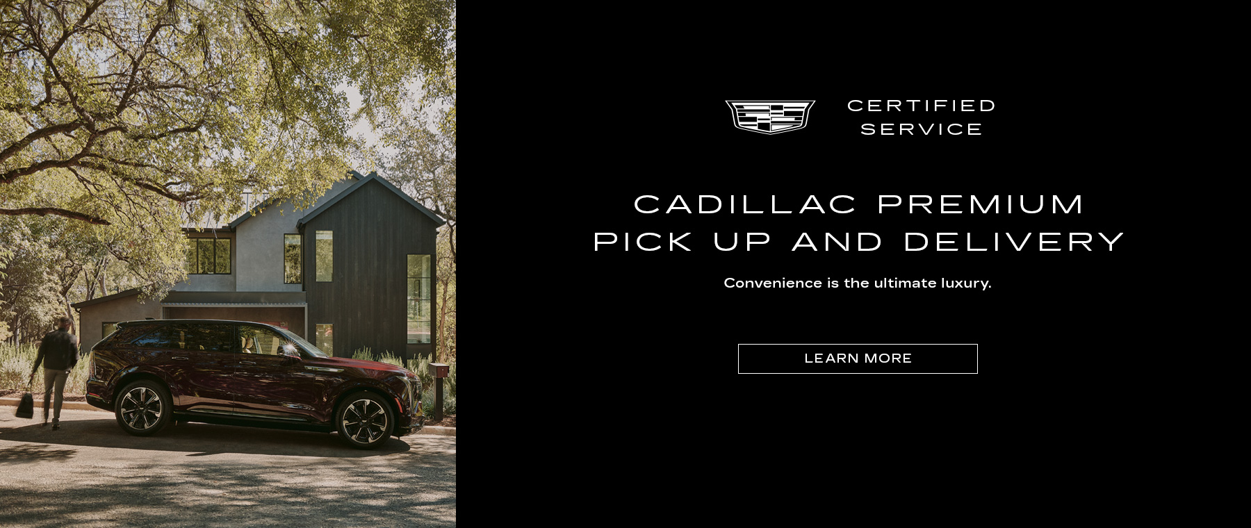 Maroon Cadillac SUV with Grey & White house in the backgroun